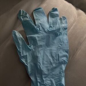 1 small blue nitrile glove